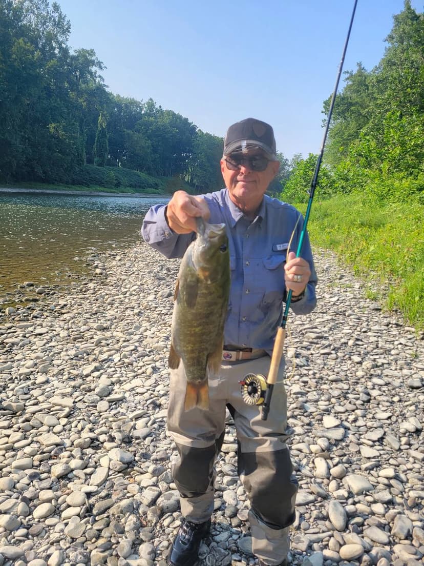 Craig, founder of Fishaholics Anonymous, fly fishing on the water
